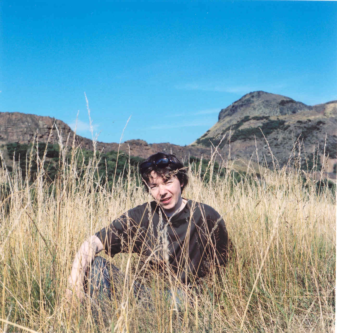 tom sitting in park